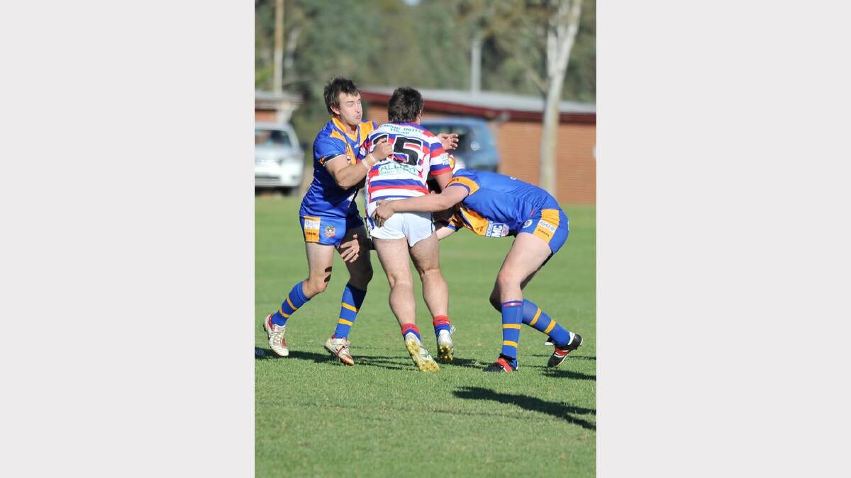 Junee's Blake Cowled and Jackson Metcalfe stop Young's Drew Arabin. Picture: Alastair Brook