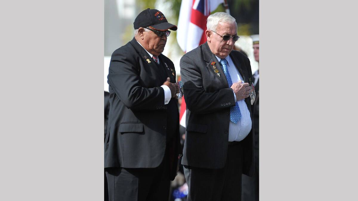 Vietnam Veterans Hewitt Whyman and Neville Smerdon paying their respects at the Anzac Day march in Wagga. Picture: Michael Frogley