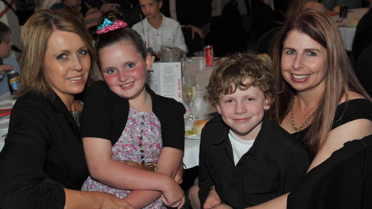 Rebecca Kelly with Jessica Kelly, 8, and Chrissy Millie with Ethan Millie, 10, at the Lake Albert Soccer Club presentation night. Picture: Les Smith