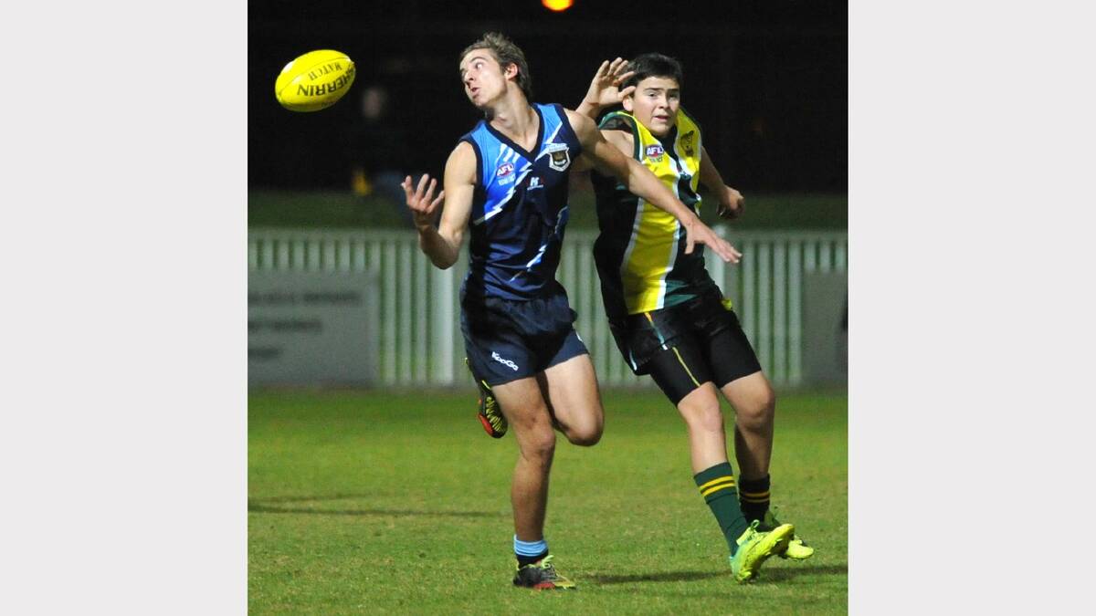 Wagga High School's Harry White spills a mark as Isaac Wichman tries to defend him. Picture: Les Smith