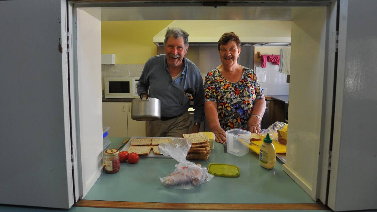 Chris and Lorraine Thomas making some sandwiches at the Wesley Uniting Church. Picture: Addison Hamilton
