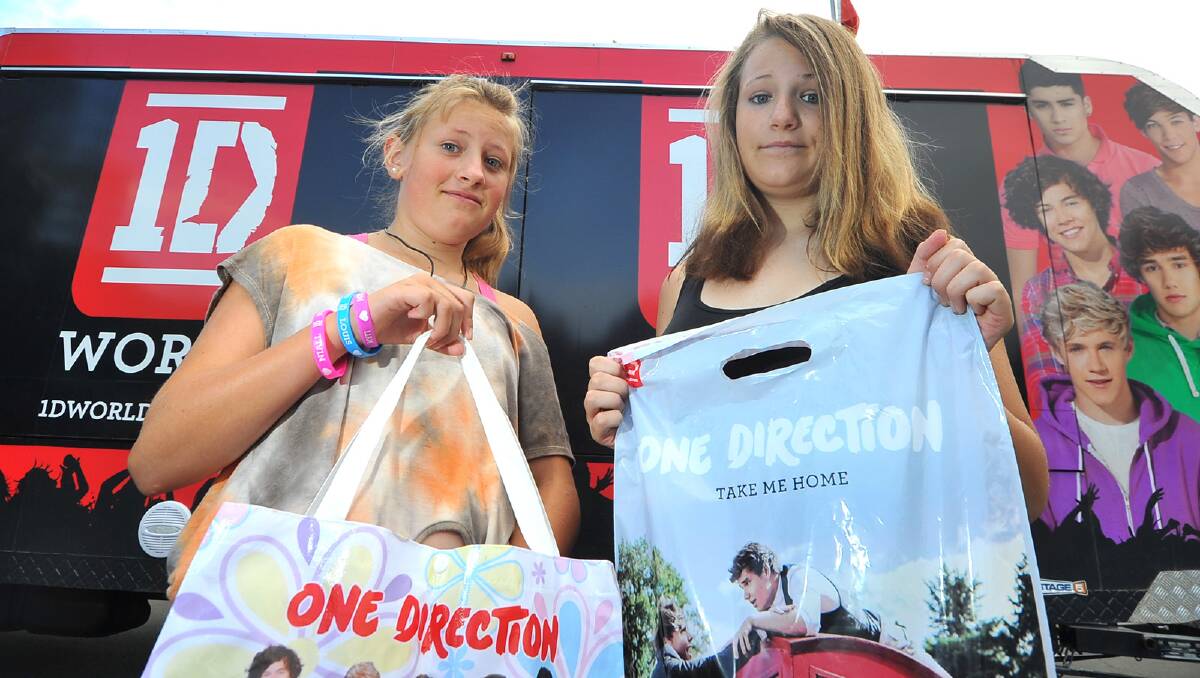 Emma and Courtney Jacobsen show off their new One Direction purchases. Picture: Addison Hamilton