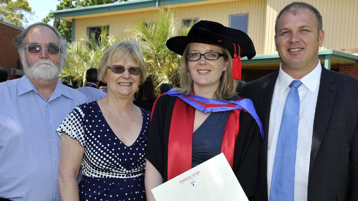 Kevin and Karen Olsen with their daughter Dr Marissa Olsen and her husband Samuelson after Marissa completed her PhD. Picture: Les Smith