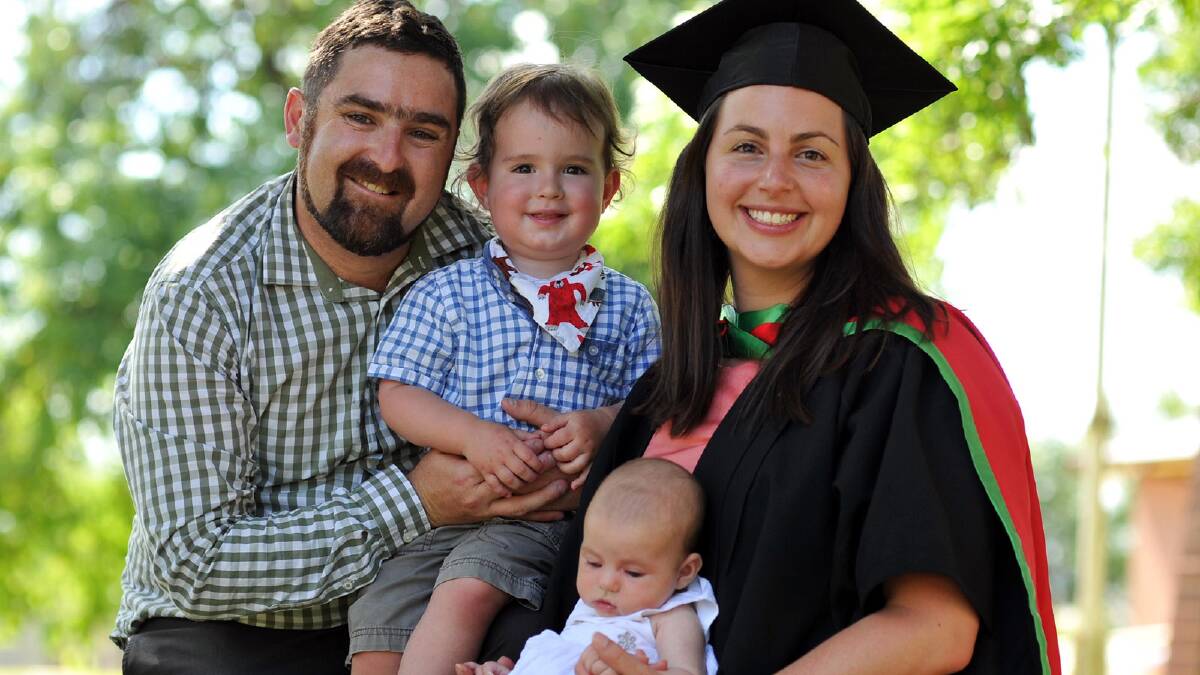 Meghan Douglas-Dowling of Hepburn VIC graduated with a Master of Education Teacher Librarianship with husband Sebastian and children Toby, 2, and Merri. Picture: Michael Frogley 