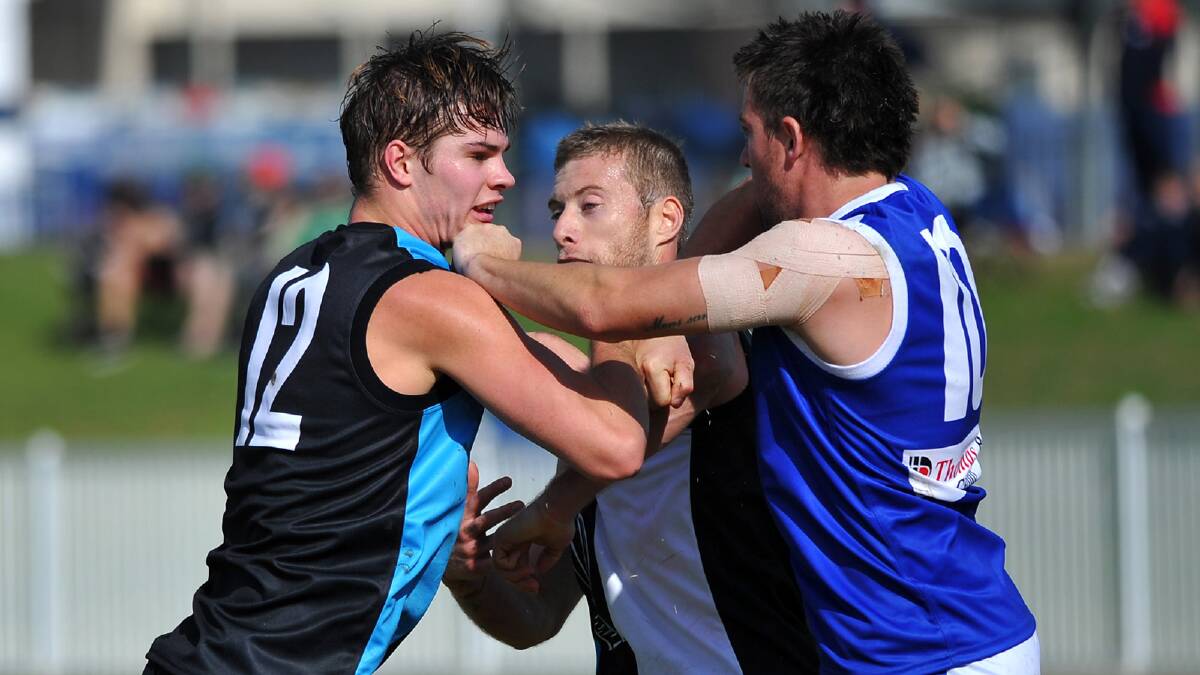 Farrer League player Mitch Ward settles a disagreement with Black Diamond pair Andrew Wilmot and James Polglase. Picture: Addison Hamilton