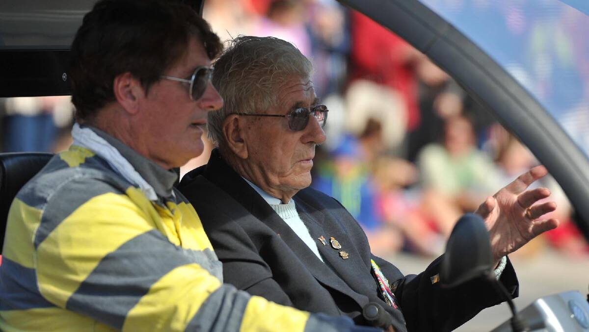 Kevin Rapmund with his father Peter Rapmund in the Anzac Day march in Wagga. Picture: Michael Frogley
