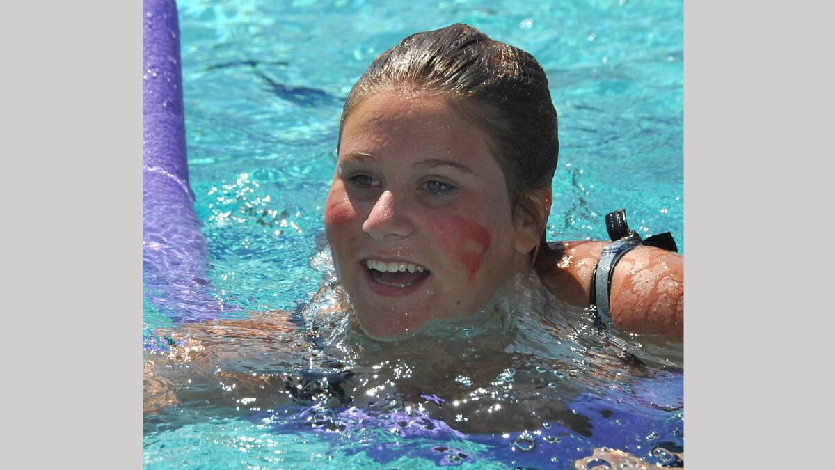 Kelli Cotter, 16, in the novelty event at the Mount Austin swimming carnival. Picture: Les Smith