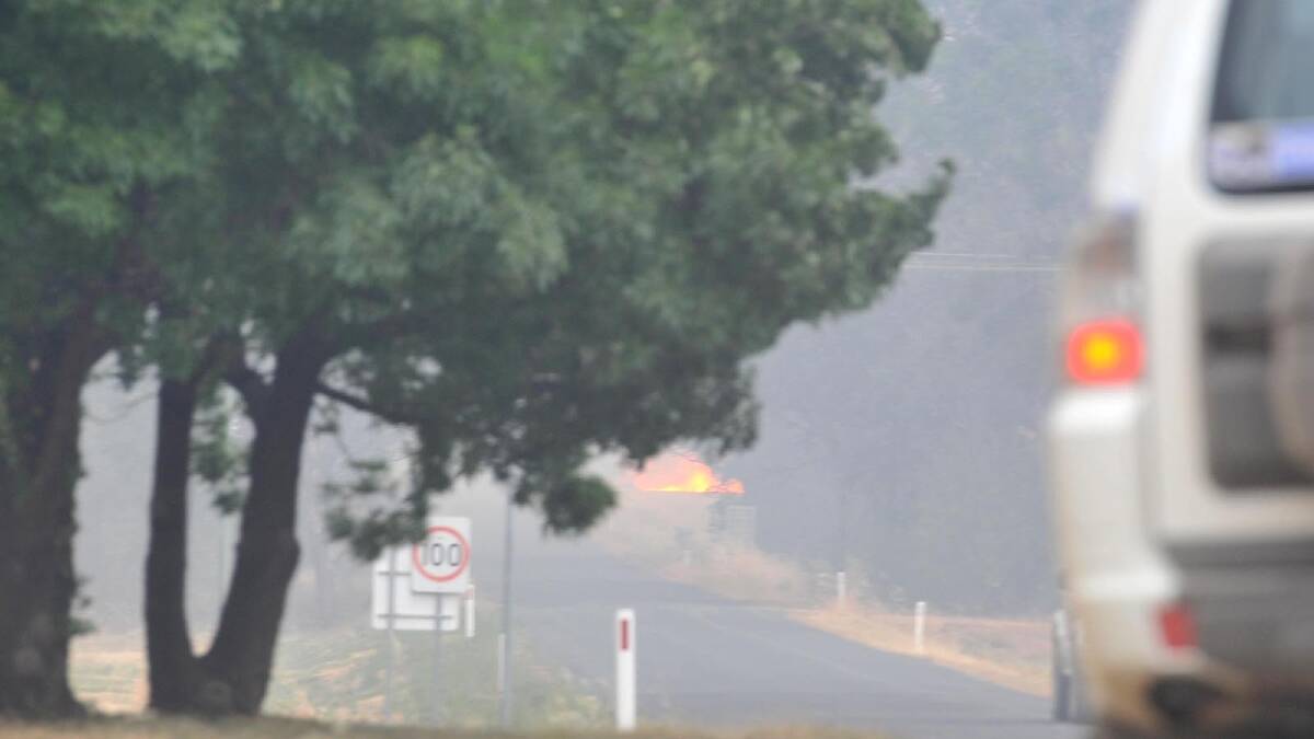 The blaze approaches the township of Stockinbingal. Picture: Michael Frogley