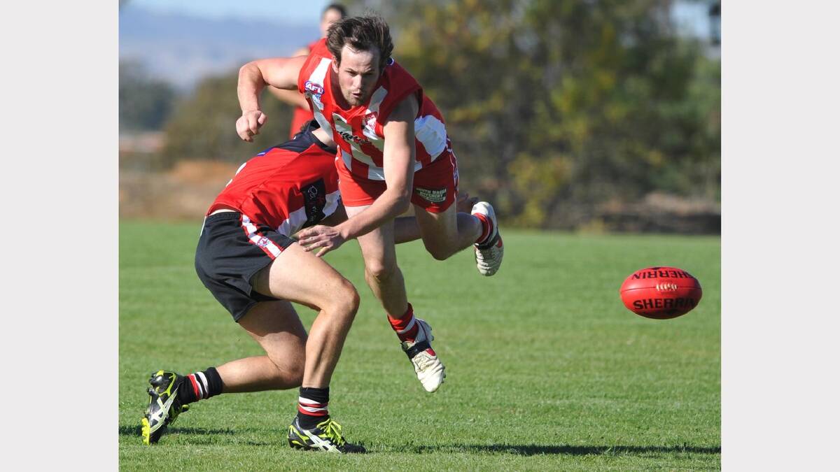 CSU's Brett Garrett chases after the ball under pressure from Ben Lucas. Picture: Les Smith