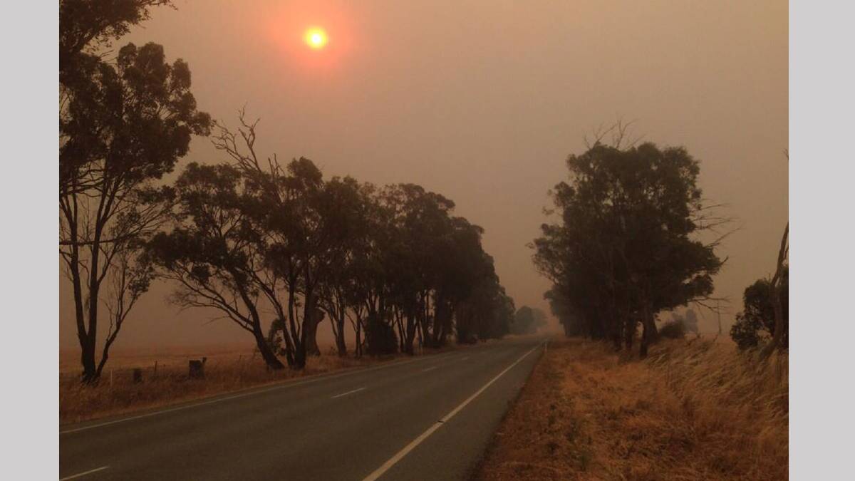 The smoke from the Springdale fire over the Burley Griffen Way. Picture: Andrew Pearson