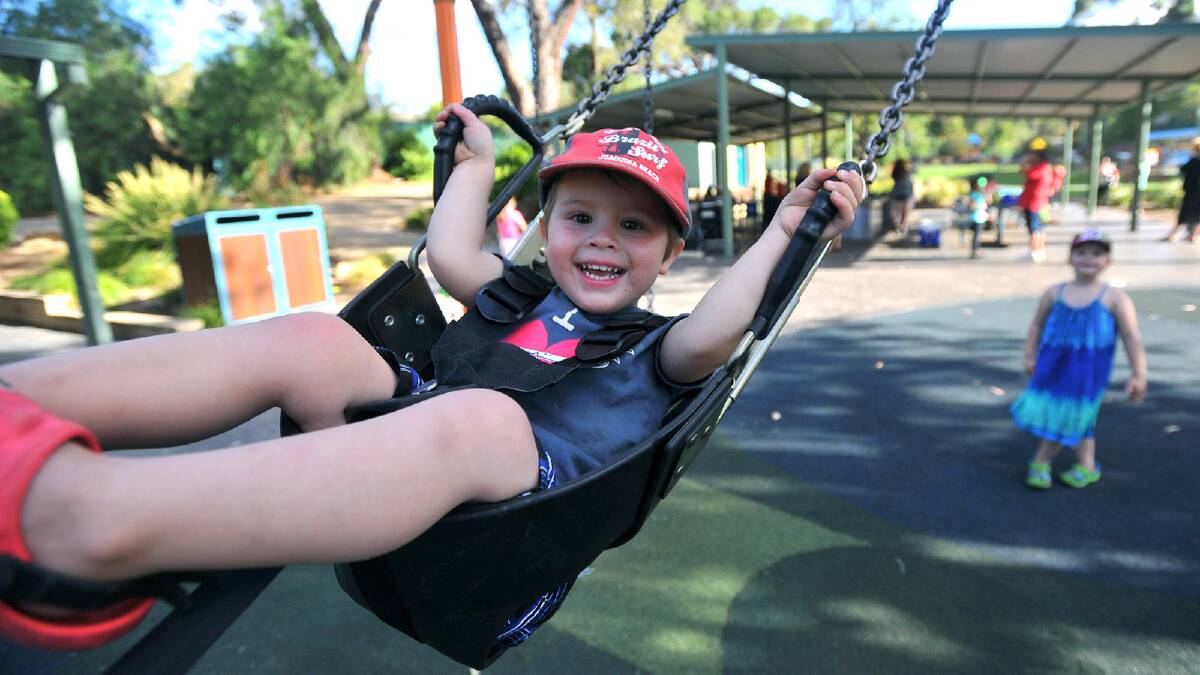 Maxx Fellows, 2, getting a push on the swing by his sister Gabrielle, 4, at the Mawang Gaway Aboriginal Consultative Group. Picture: Addison Hamilton