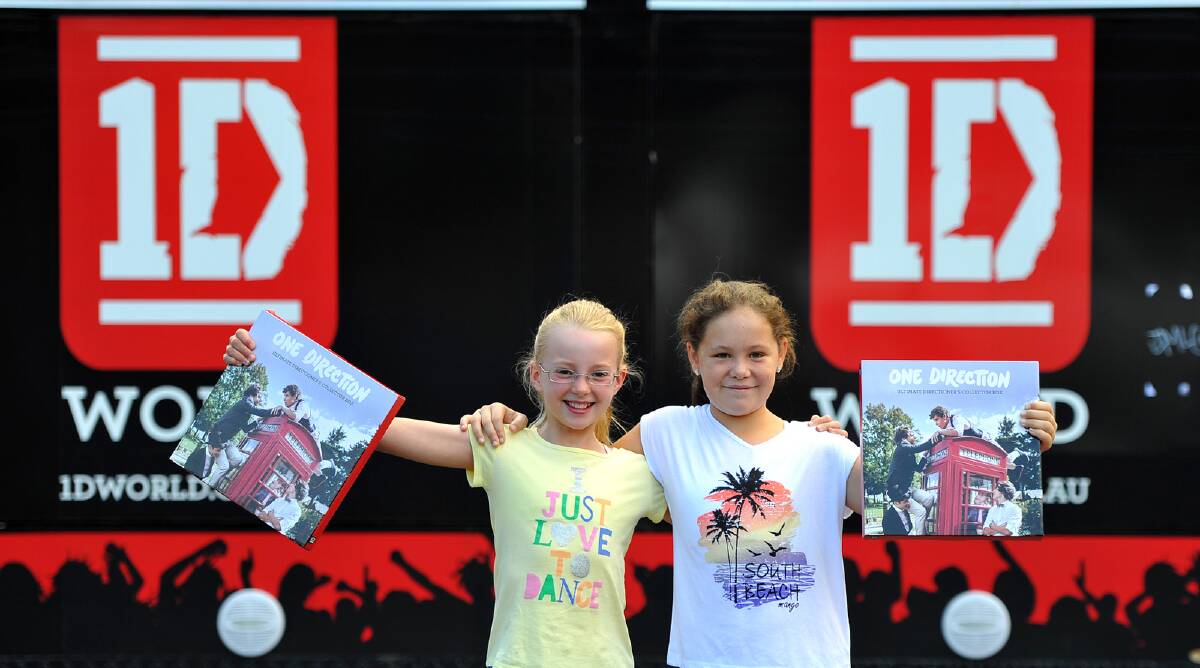  Hope Gray, 10 and Sophie Merrylees, 10 show off their new One Direction merchandise. Picture: Addison Hamilton