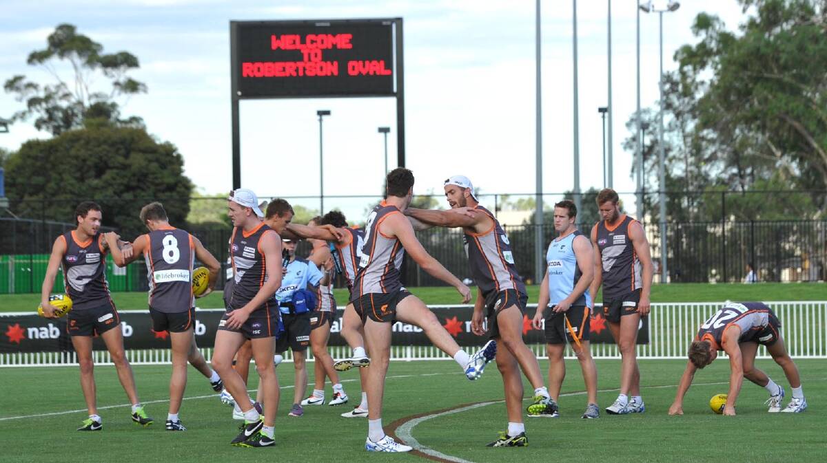 GWS warming up for their training run on Robertson Oval. Picture: Les Smith
