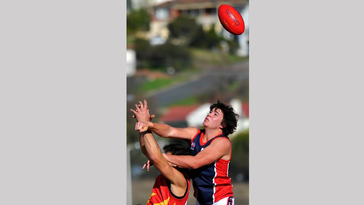 John Anstee rises high to spoil the ball away from Sydney under 23s Paul Sain. Picture: Addison Hamilton