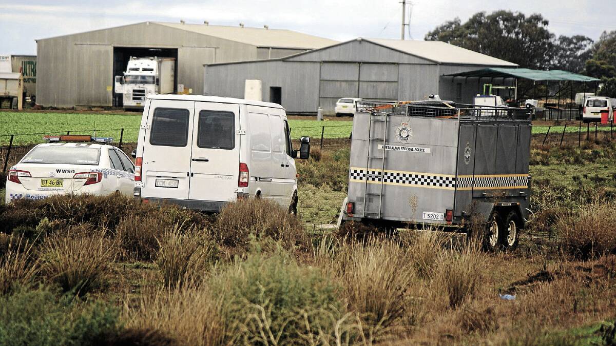 INVESTIGATION: Police prepare to search a property near Hay with the hope of finding the remains of Don Mackay.