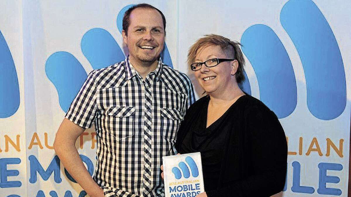 TOP DROP: 365cups co-founder Simone Eyles (right) and business partner  Mariusz Stankiewicz proudly show off the national mobile award they won on Thursday night. 	Picture: Contributed