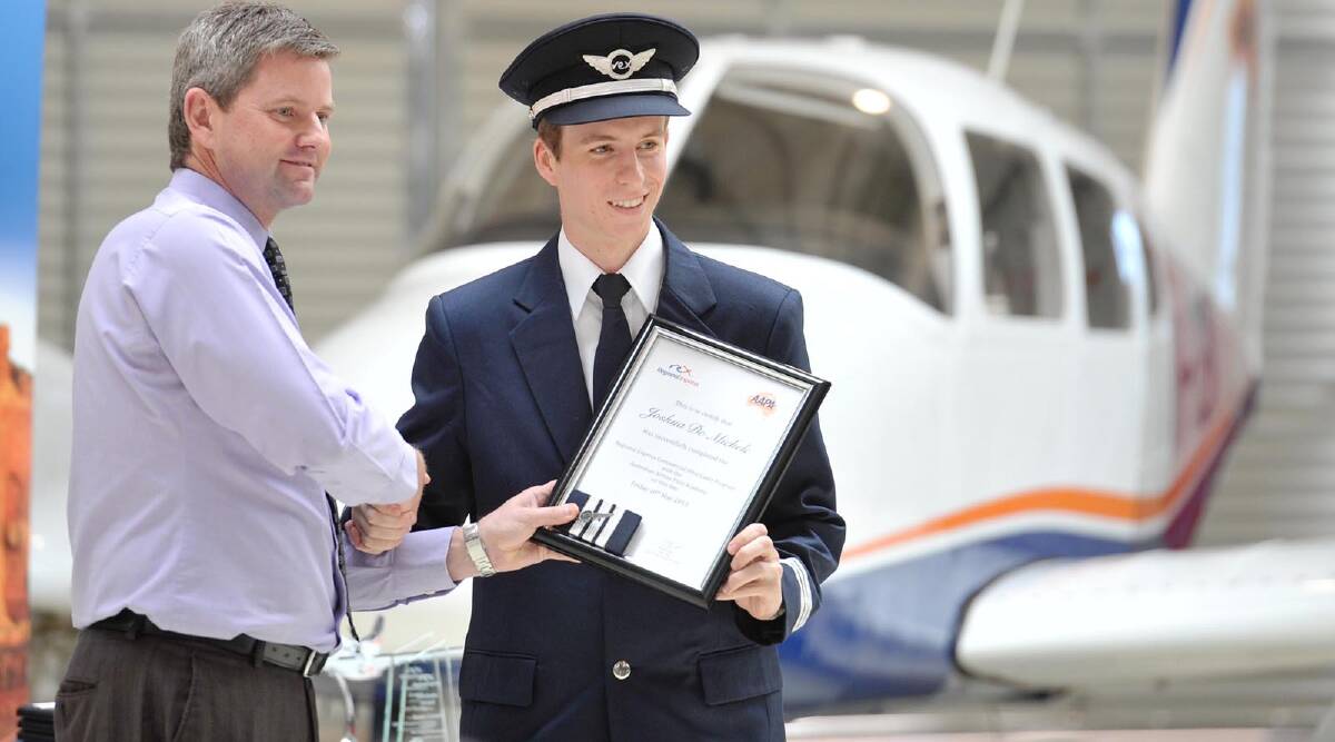 AAPA General Manager Geoffrey Cook hands certificate to Joshua De Michele. Picture: Alastair Cook