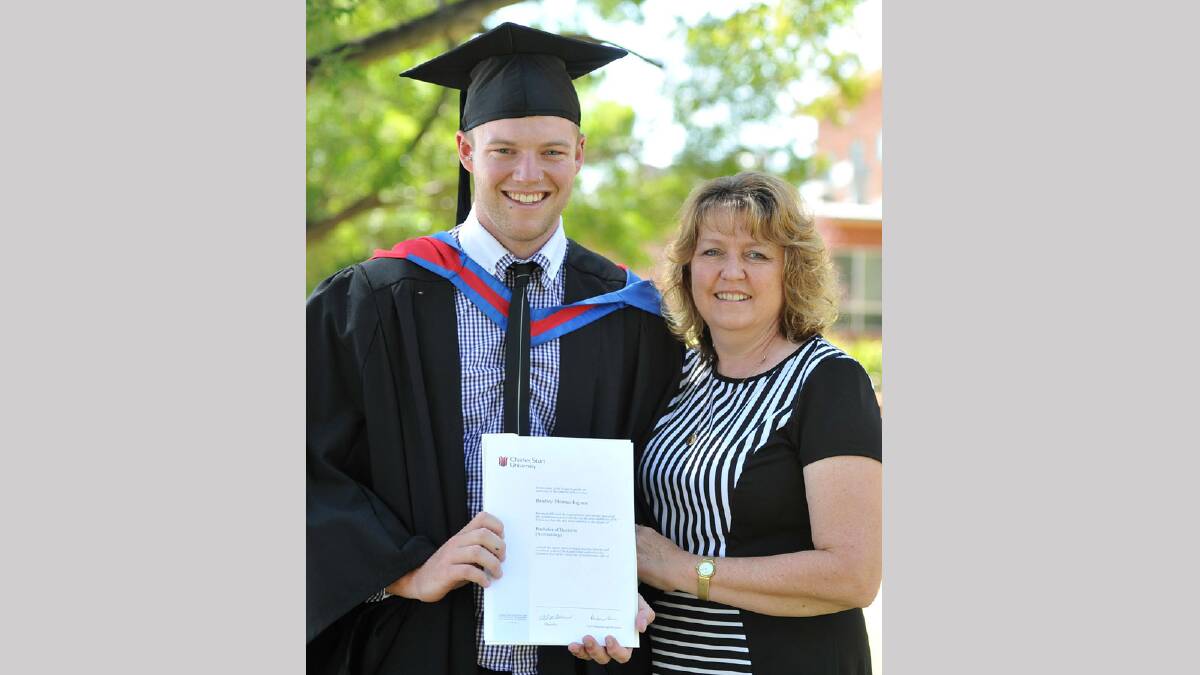 Bradley Ingram is congratulated on his Bachelor of Business (Accounting) by his mother Maree. Picture: Michael Frogley