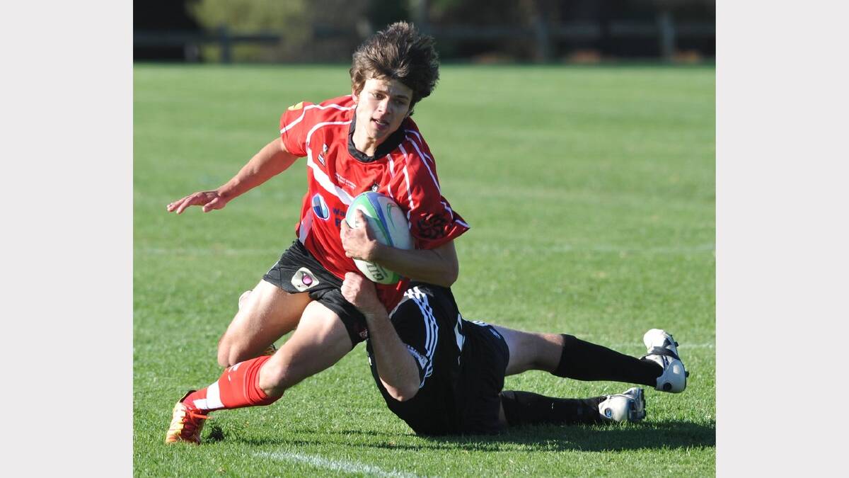 CSU's Brett Wendt is tackled by Griffith's Jason Waring-Bryant. Picture: Les Smith