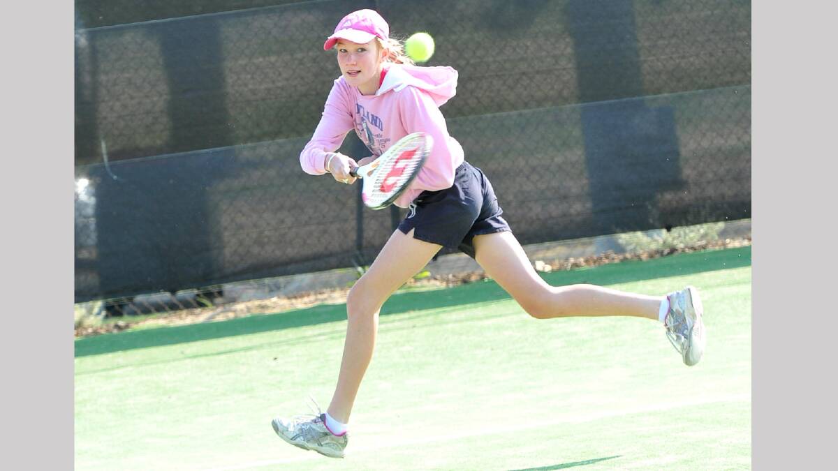 Whitney Driscoll, 14, strides to the ball at the Jim Elphick Tennis complex. Picture: Michael Frogley 