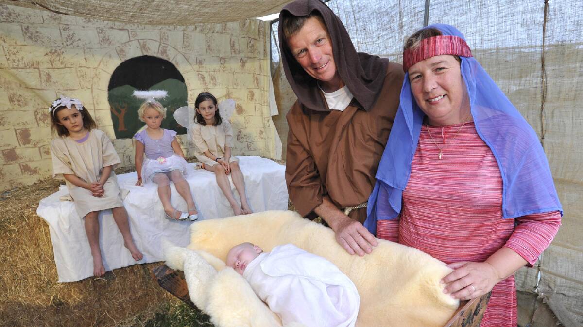 Playing Jesus on the first night of Come To Bethlehem is three-month-old Teresa Bell with Craig and Jackie Ambler , with the angels Charley Clout, 8, Bridget Bell, 3, and Bayley Clout, 7, looking over them in the background. Picture: Les Smith