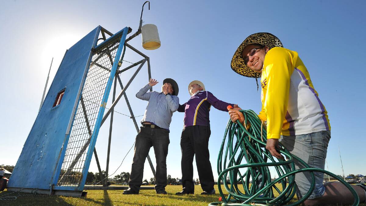 Relay for Life chairperson Bill Woods about to dunk councillors Rod Kendall and Kevin Poynter. Picture: Addison Hamilton