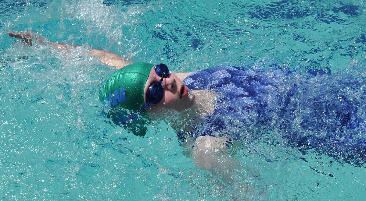 Georgie Stephens, 9, of Henschke Primary School in a backstroke race. 