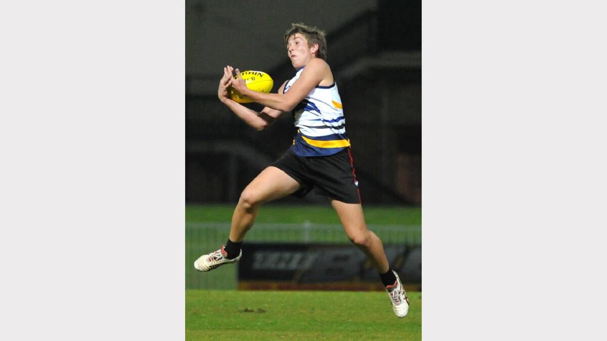 Kooringal High School's Tom Pocock takes a mark in the Carroll Cup game against TRAC. Picture: Les Smith