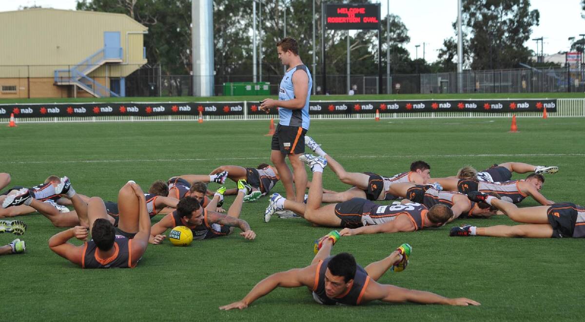 GWS warming up for their training run on Robertson Oval. Picture: Les Smith