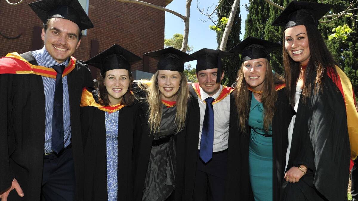 Pharmacy grads Matthew Tom, Annie Rookyard, Katherine Truscott, Tom McCalman, Maron Hydepage and Amanda Harvey after their ceremony. Picture: Les Smith