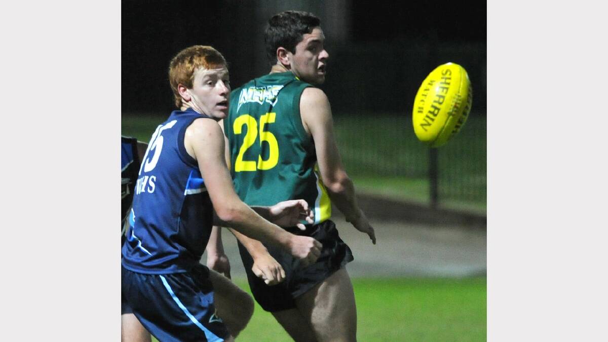 Wagga HIgh's Harry White (left) Mount Austin's Isaac Wichman chase after the ball. Picture: Les Smith