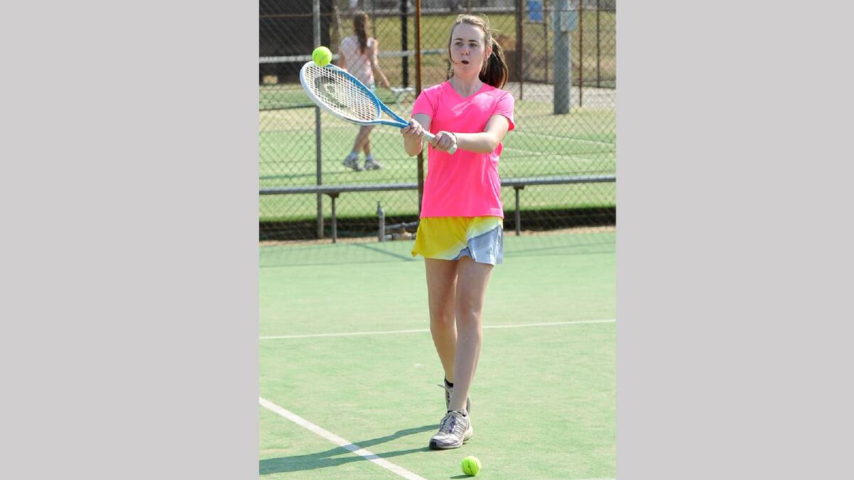 Sally Millard, 13, plays a volley in junior tennis. Picture: Michael Frogley