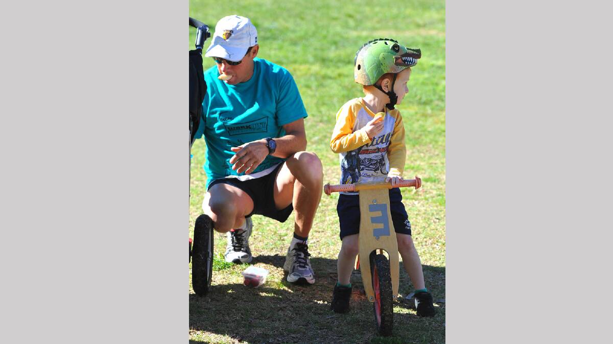 Lake to Lagoon 2013 - Greg and Jax Knight, 3, of Wagga have some pre-race snacks. Picture: Addison Hamilton