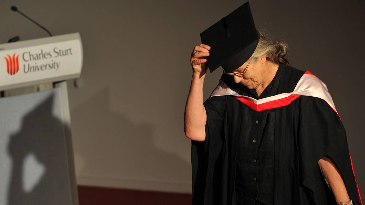 Elizabeth Harding doffs her cap before receiving a her Bachelor of Arts (Multimedia Arts) degree. Picture: Addison Hamilton