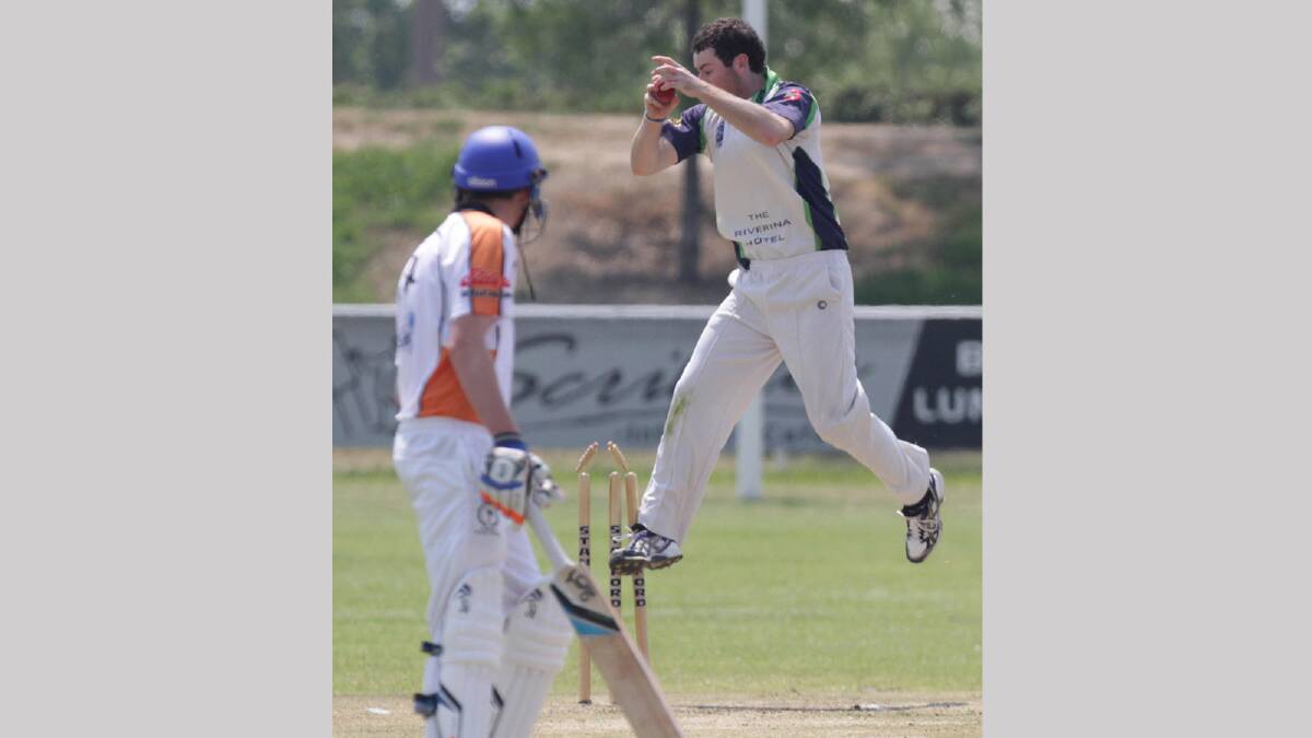 Wagga's RSL Aaron Maxwell jumps high to take a wicket as Sam Perry looks on. Picture: Les Smith