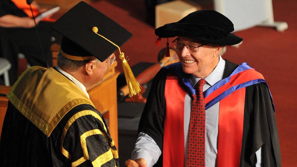 Chancellor Lawrence Willett presents Timothy Hutching with his Doctor of Philosophy. Picture: Michael Frogley