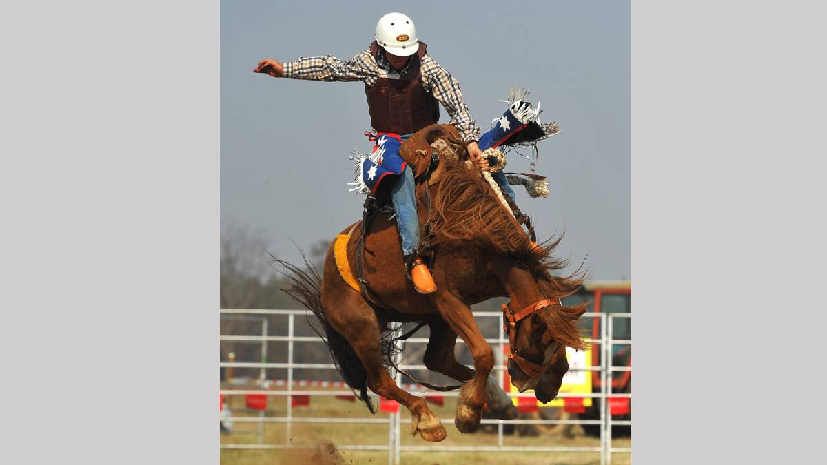 Stephen Rauch in the second division bronco riding competition at the Coolamon Rodeo. Picture: Addison Hamilton