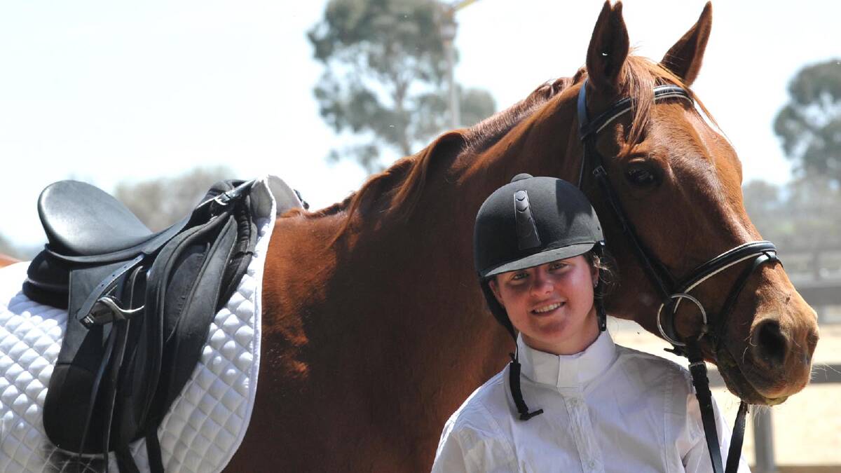Stephanie Fowler of Wagga with Katerina after competing in prep B dressage test at the CSU equestrian centre. Picture: Les Smith 