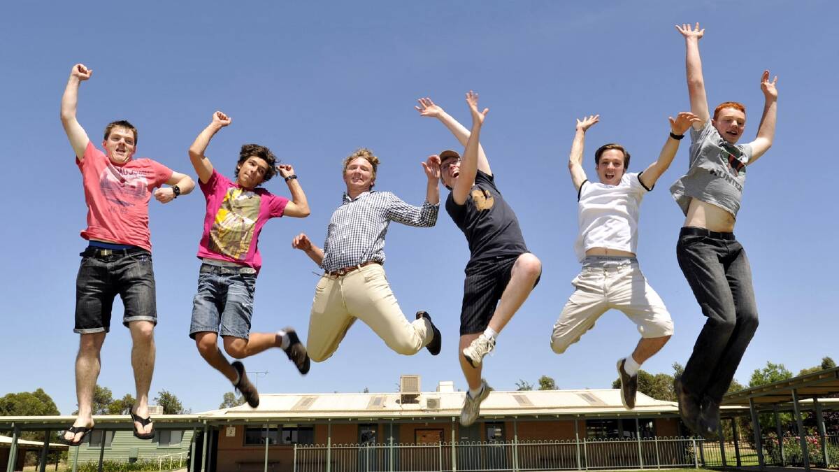 TRAC year 12 students(from left) Lachlan Wright, Bootsie Volt, Angus Lloyd, Alex Salan, Sebastian Holzapfel and Alex Ford  jump for joy after receiving their HSC results. Picture: Les Smith