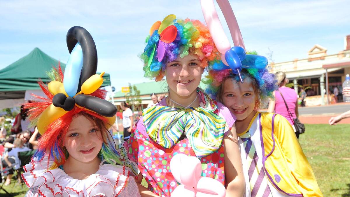Wagga Clown Club members Zahra Crampton, 7, Bronnie Pieper, 14, Tamara Pieper,9, at the Coolamon Scarecrow Festival. Picture: Alastair Brook