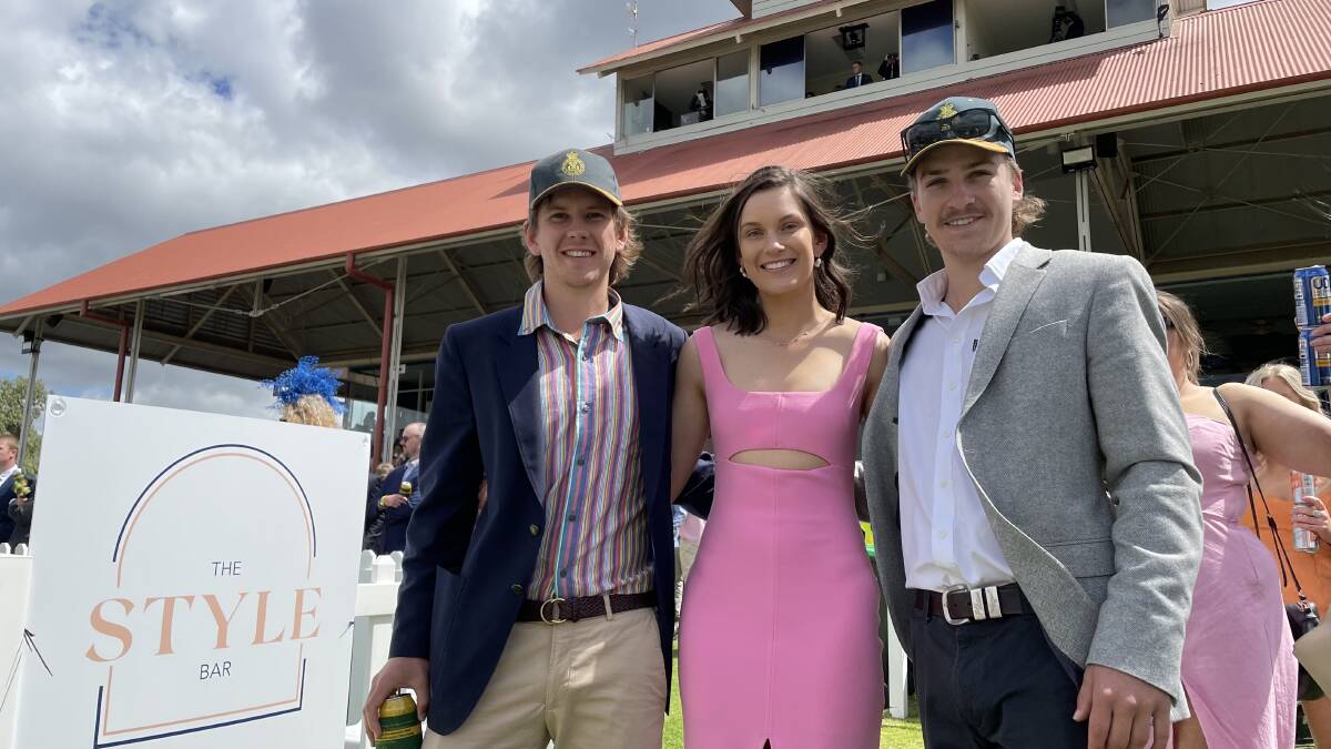 Race day coordinators Will Headlam, Angie Molyneaux and president Will Nixon were thrilled to be back, and they weren't the only ones. Picture: Penny Burfitt