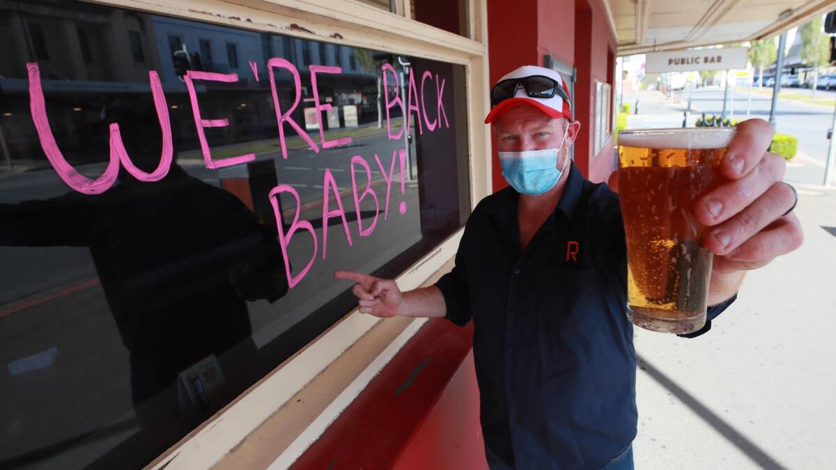 CHEERS TO THE WEEKEND: Romanos Hotel's Mathew Oates is one of many business owners who are relieved to see restrictions eased. Picture: Les Smith 
