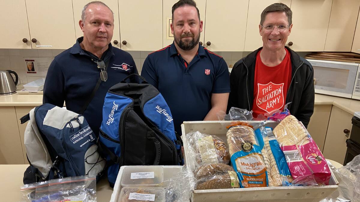 Every week, volunteers Ned Jones, Matt George and Russell Cocks head out armed with hot meals and essential products to support the city's homeless. Picture: Penny Burfitt