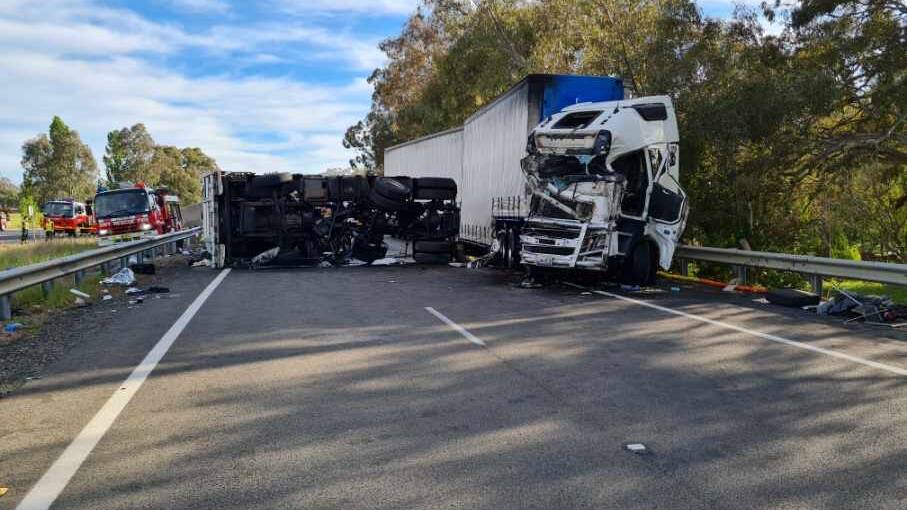 Crash Investigation is trying to determine the cause of the crash, with Fire and Rescue standing by to clear a toxic spill. Picture: FRNSW