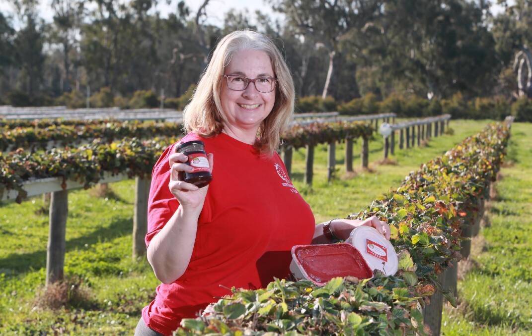 BERRY GOOD NEWS: Bidgee Strawberries and Cream's Kylie Cashen shows off their home-grown produce sold on site. Picture: Les Smith