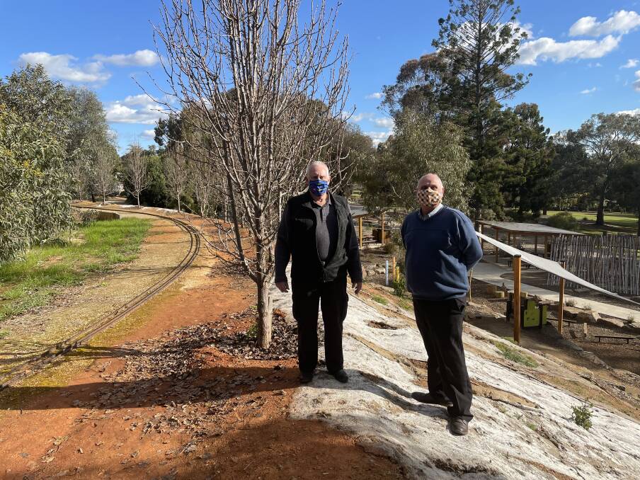 EASY ACCESS: Wagga Model Engineers Society president Jim Weedon and Peter Micenko say access up the hill from the adventure playground has created a serious problem. Picture: Penny Burfitt