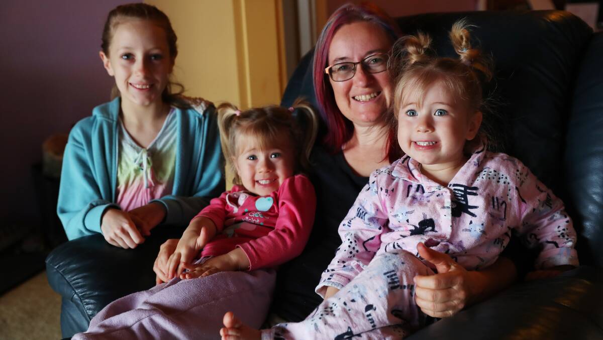 JUST HAIR: Mum of five girls Rachel Lidden with daughter's (L-R) Ashley, 11, Emily, 3, and Lauren, 3. Picture: Emma Hillier