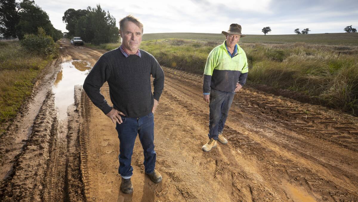 A BIT SAD: Ferndale Boundary Road residents Peter Webster and Rodney Trethowan.are disappointed neither Lockhart or Greater Hume Councils have taken responsibility for the upkeep of the dirt road. Picture: ASH SMITH