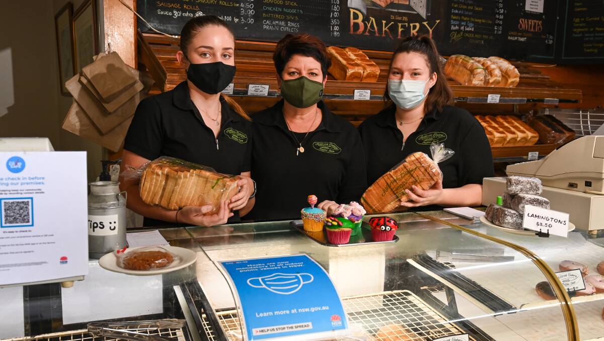 MASK UP: Holbrook Bakery staff member Alice Wheeler, owner Lisa Wheeler and staff member Lucy Ferguson. The bakery has been dealing with a loss in business and people not wearing masks during the Sydney and Victorian lockdowns. Picture: MARK JESSER
