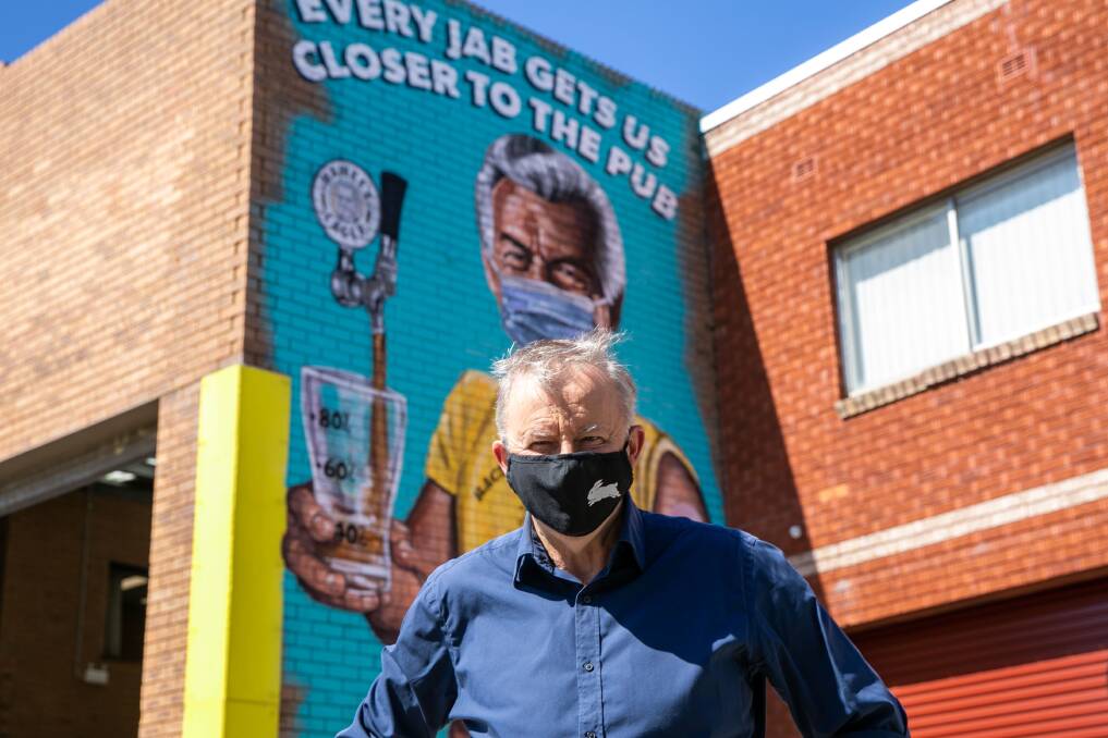 THEN AND NOW: Albanese outside Hawke's Brewing Company in Marrickville, in front of a Scott Marsh mural of former Labor PM Bob Hawke.